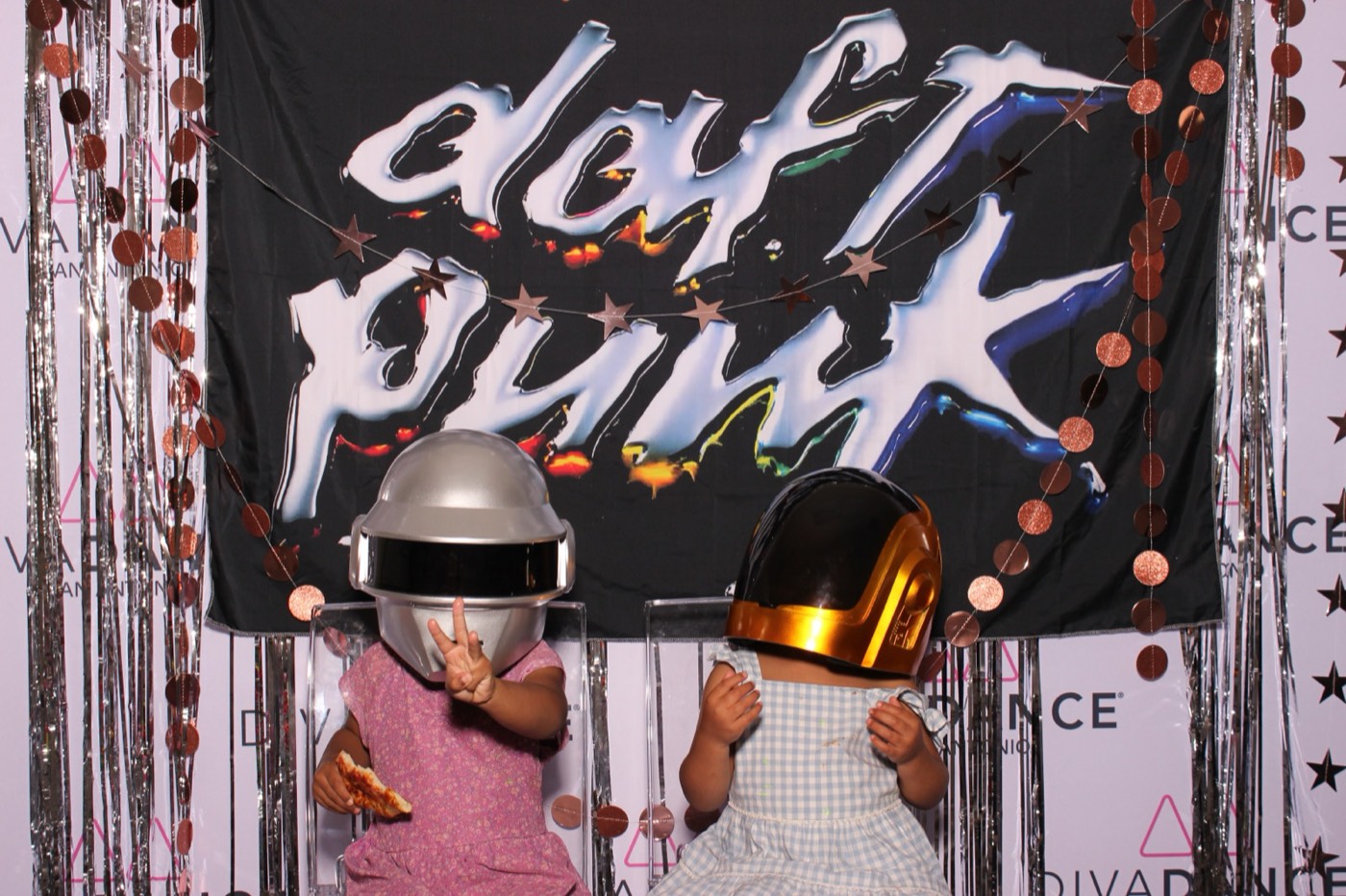 Two kids in Daft Punk robot helmets at a Daft Punk themed birthday party